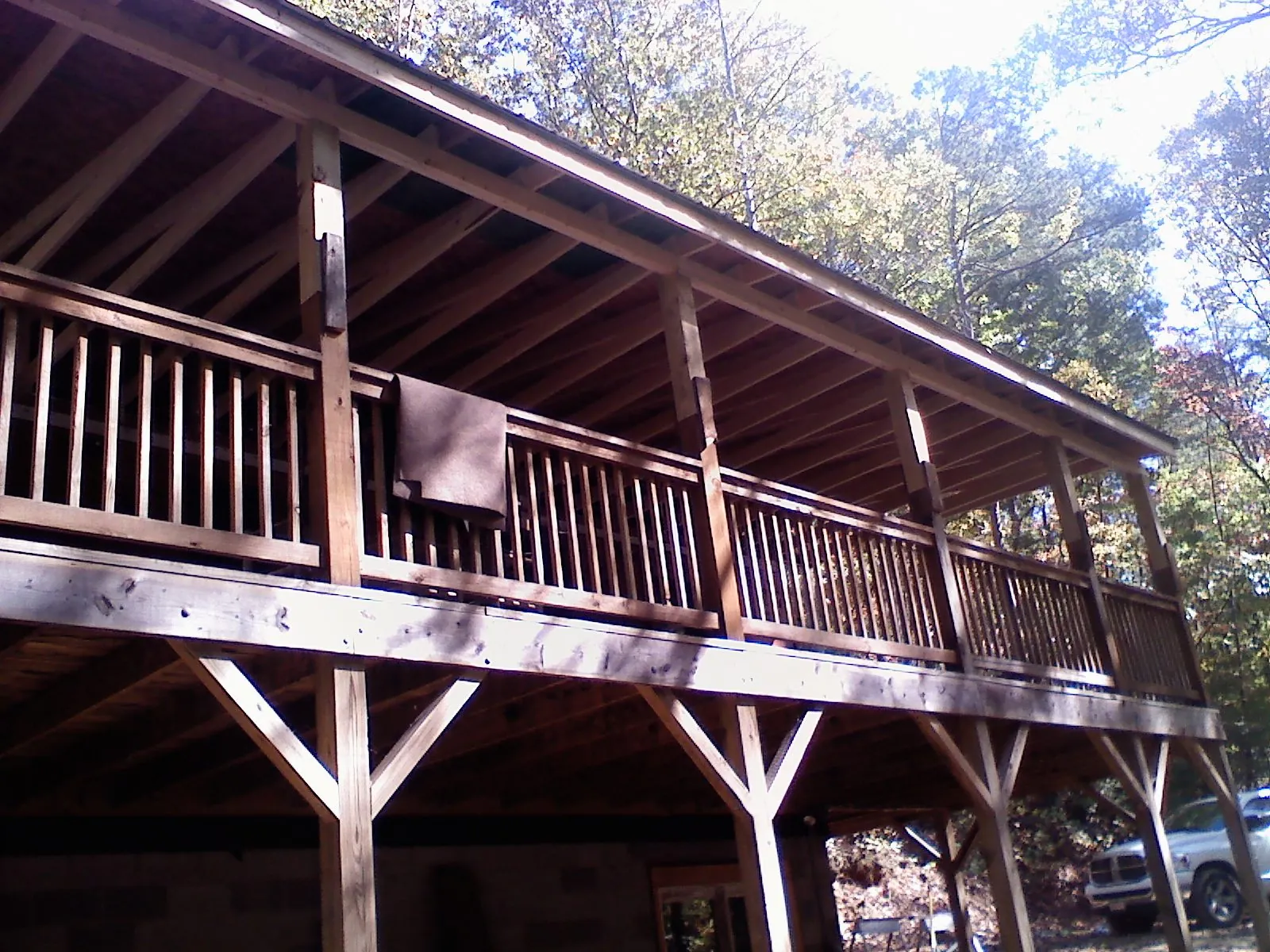 Timber framing under a new elevated porch and deck — Roof Leak Repair in Sharon Center by Roofing Brothers